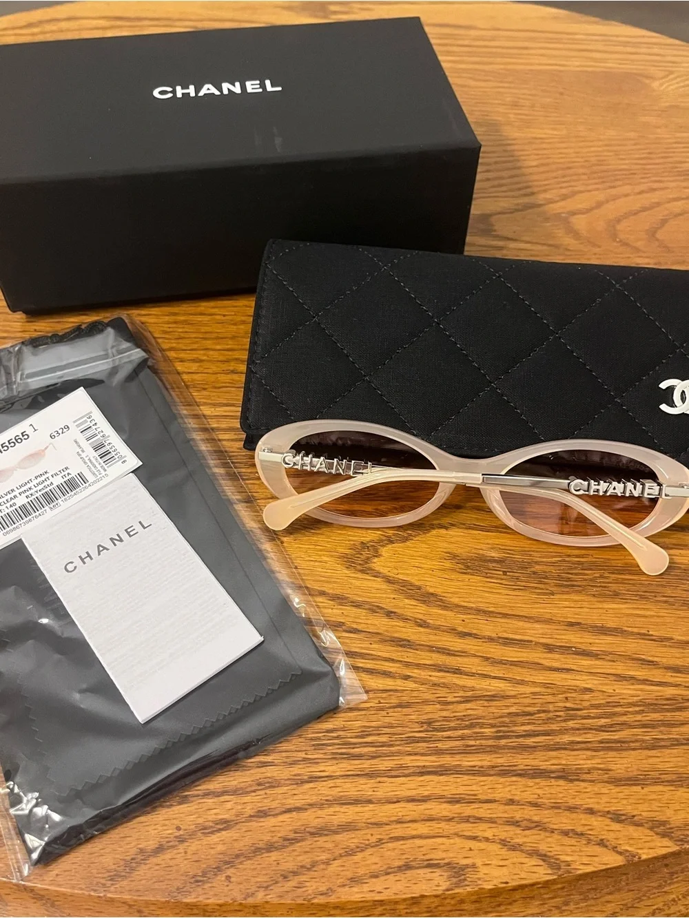 CHANEL Translucent Pale Pink Oval Sunglasses